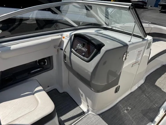 Slide: The Image of 2017 Chaparral 250 Suncoast boat interior with helm and seating area. - 13