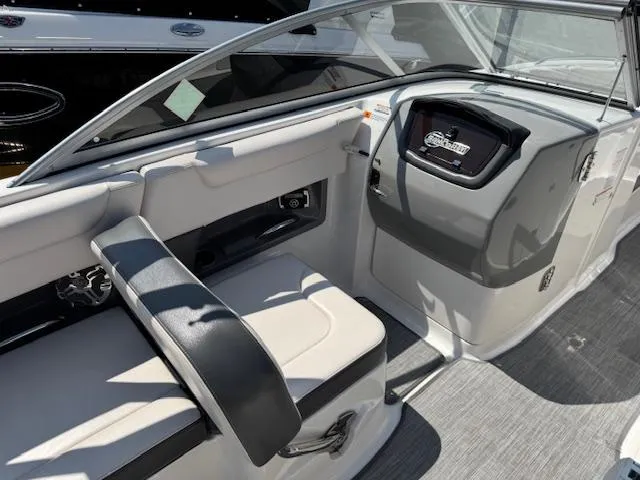 Slide: The Image of 2017 Chaparral 250 Suncoast boat interior with seating and dashboard. - 16