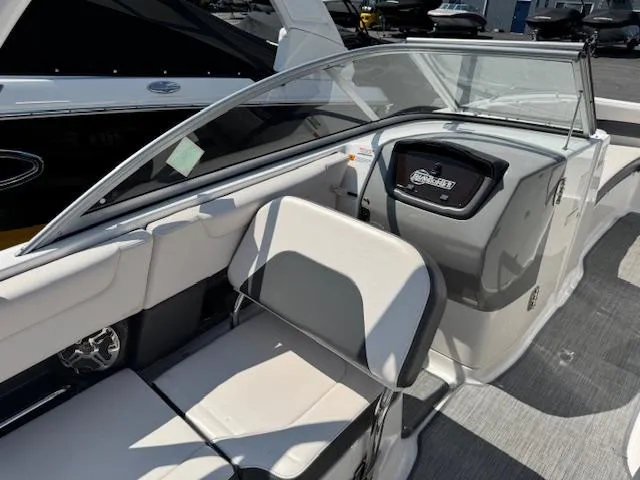 Slide: The Image of 2017 Chaparral 250 Suncoast boat interior with seating and dashboard. - 17