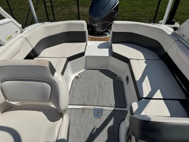 Slide: The Image of 2017 Chaparral 250 Suncoast boat interior with spacious seating and modern design. - 19