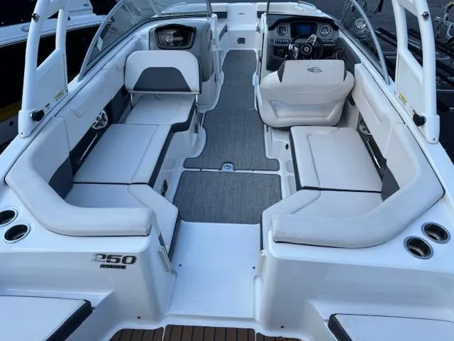 Slide: The Image of 2017 Chaparral 250 Suncoast boat interior with spacious seating and modern dashboard. - 2