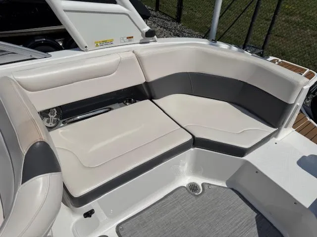 Slide: The Image of 2017 Chaparral 250 Suncoast boat interior with white and gray seating. - 22