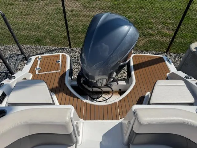 Slide: The Image of 2017 Chaparral 250 Suncoast boat with outboard motor and teak deck, viewed from above. - 24