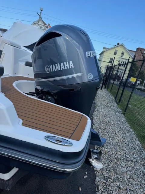Slide: The Image of 2017 Chaparral 250 Suncoast with Yamaha 300 outboard engine, docked on gravel. - 25