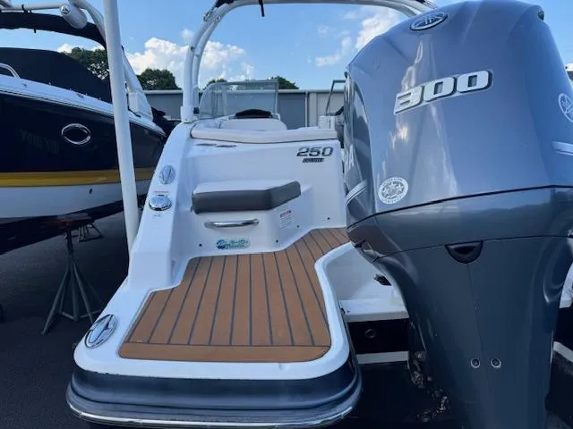 Slide: The Image of 2017 Chaparral 250 Suncoast boat with Yamaha 300 engine, docked outdoors. - 26