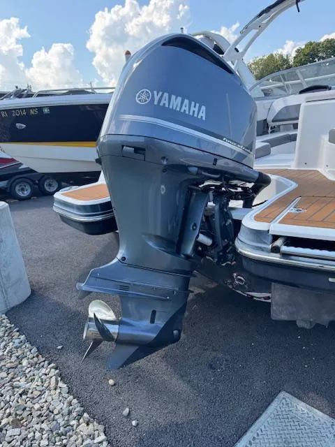 Slide: The Image of 2017 Chaparral 250 Suncoast with Yamaha outboard motor, docked on a sunny day. - 28