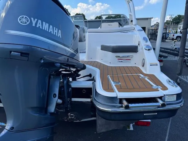 Slide: The Image of 2017 Chaparral 250 Suncoast boat with Yamaha outboard motor, featuring teak swim platform. - 29