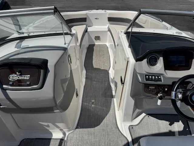 Slide: The Image of 2017 Chaparral 250 Suncoast boat interior with dual consoles and steering wheel. - 4