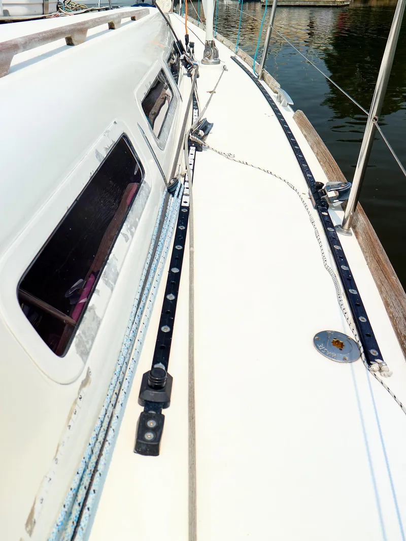 Slide: The Image of Deck view of 2011 Dufour 40E Performance sailboat, showing rigging and windows. - 18