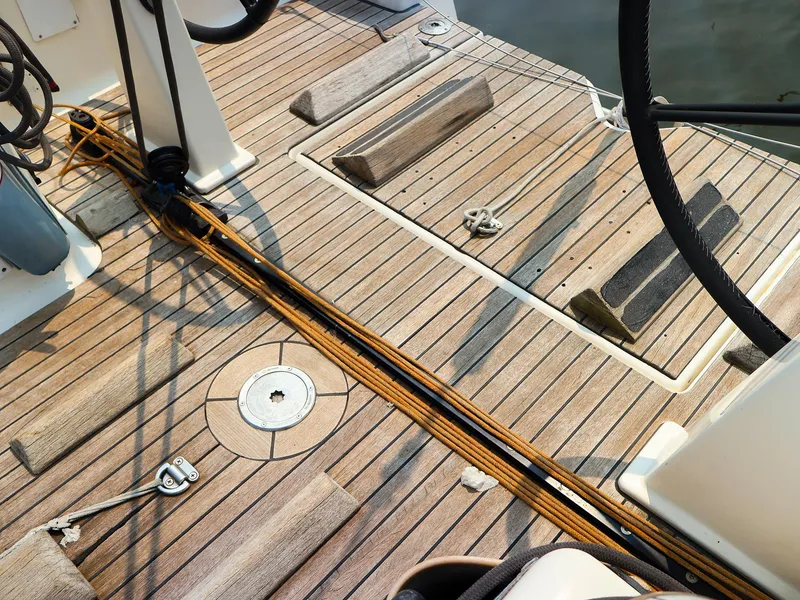 Slide: The Image of Teak deck of 2011 Dufour 40E Performance sailboat with ropes and fittings. - 21