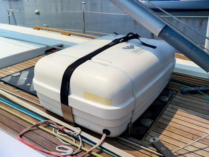 Slide: The Image of Liferaft on deck of 2011 Dufour 40E Performance sailboat, secured with straps. - 23