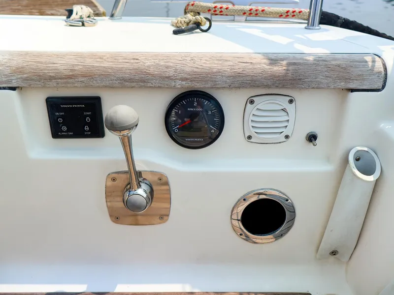 Slide: The Image of Control panel of a 2011 Dufour 40E Performance sailboat with throttle and gauges. - 24