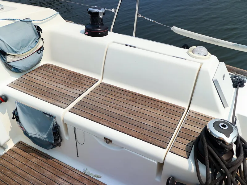 Slide: The Image of Cockpit of 2011 Dufour 40E Performance sailboat with wooden seating and winches. - 27