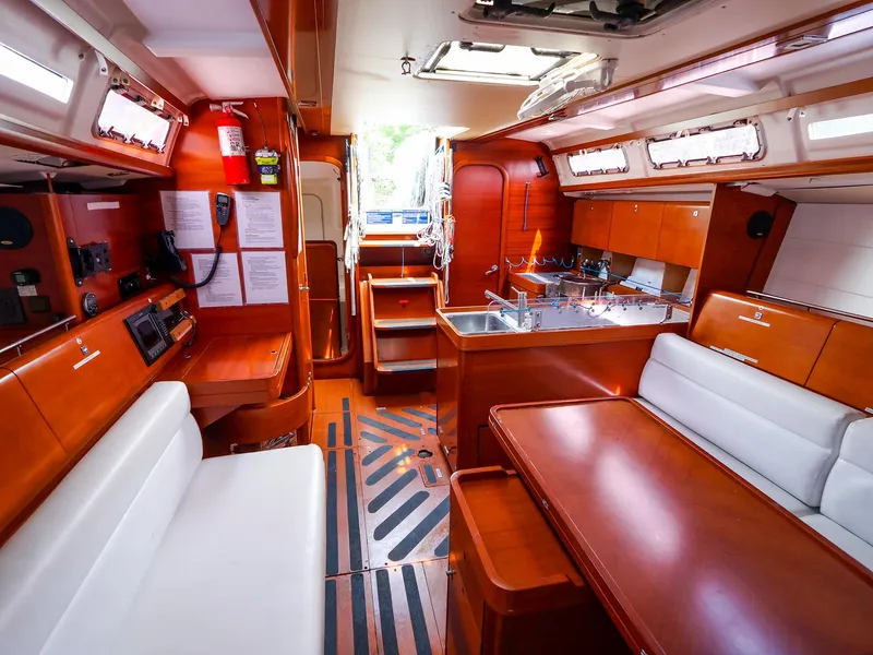 Slide: The Image of Interior of 2011 Dufour 40E Performance yacht, featuring wood finishes and modern amenities. - 35