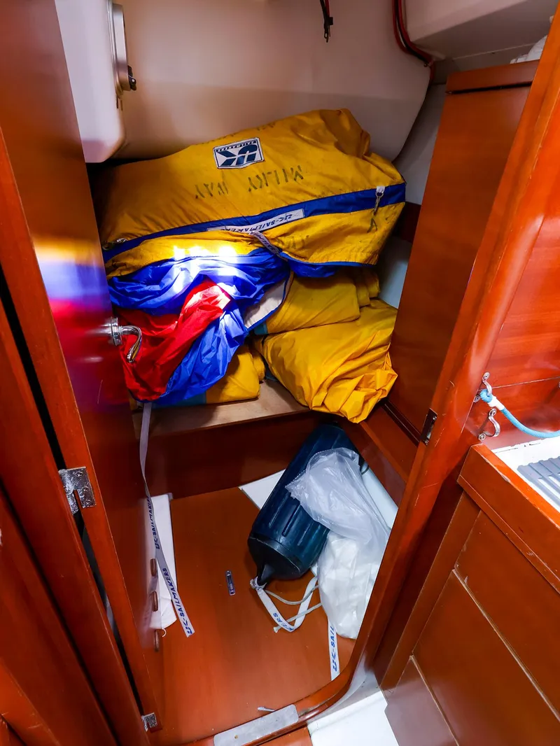 Slide: The Image of Storage compartment on 2011 Dufour 40E Performance yacht with colorful sails and equipment. - 38