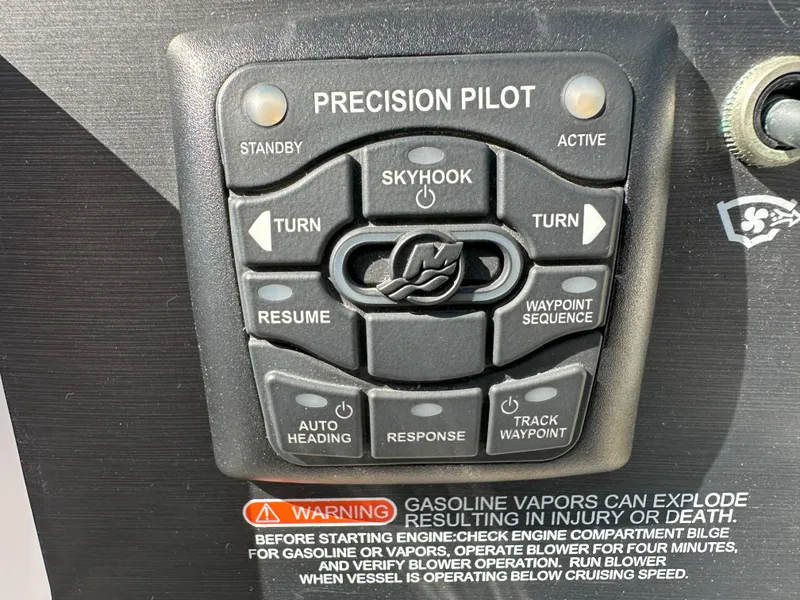 Slide: The Image of Control panel of a 2015 Sea Ray 350 Sundancer boat with warning label. - 12