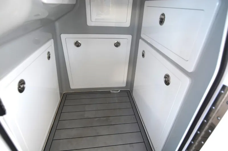 Slide: The Image of 2024 Costa Custom Boats 264HC interior storage compartments with sleek design and modern finish. - 12