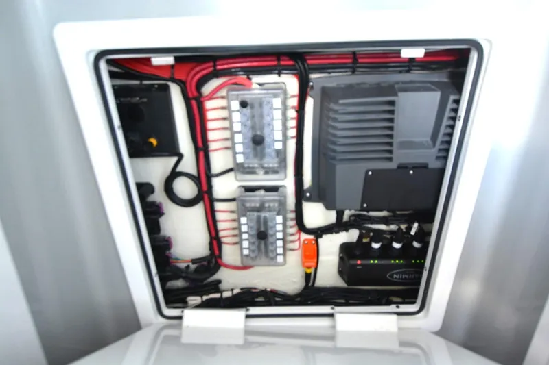 Slide: The Image of Electrical panel of 2024 Costa Custom Boats 264HC, featuring wiring and components. - 15