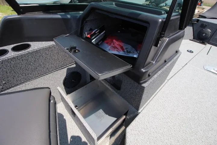 Slide: The Image of 2025 Lund 1875 Impact XS Sport boat interior storage compartments open. - 11