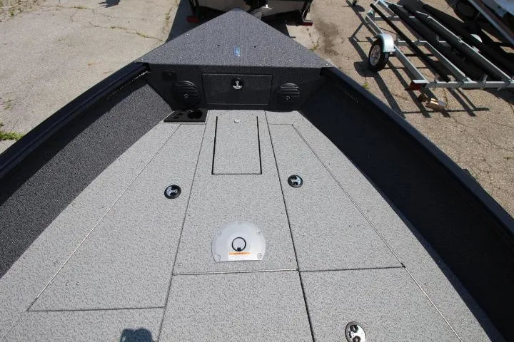 Slide: The Image of 2025 Lund 1875 Impact XS Sport boat deck with storage compartments and speakers. - 12