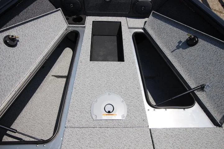 Slide: The Image of 2025 Lund 1875 Impact XS Sport boat interior with open storage compartments. - 13