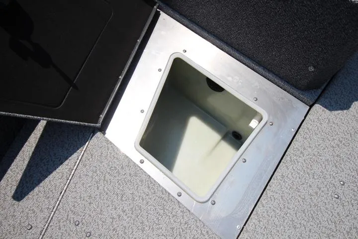 Slide: The Image of 2025 Lund 1875 Impact XS Sport boat storage compartment, open and empty. - 14