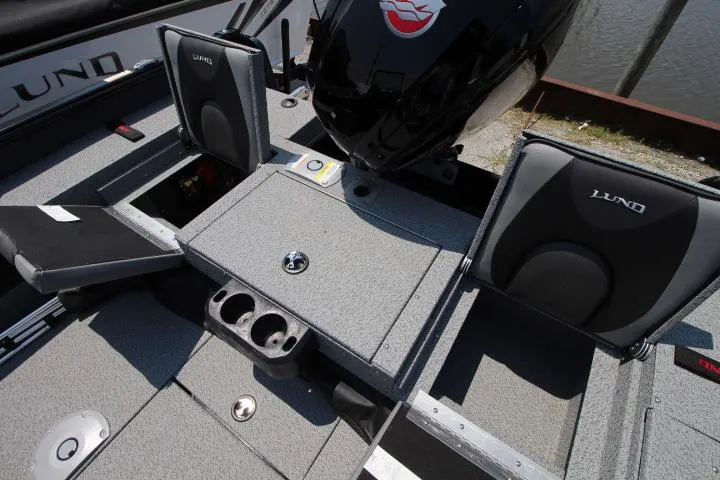 Slide: The Image of 2025 Lund 1875 Impact XS Sport boat interior with seating and storage compartments. - 15