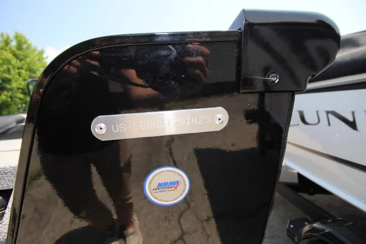 Slide: The Image of 2025 Lund 1875 Impact XS Sport boat with NMMI certification label. - 16