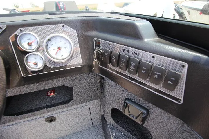 Slide: The Image of Dashboard of 2025 Lund 1875 Impact XS Sport boat with gauges and switches. - 5