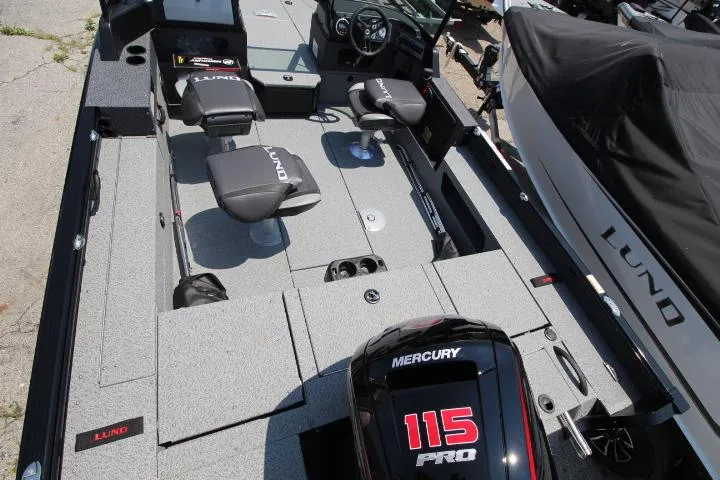 Slide: The Image of 2025 Lund 1875 Impact XS Sport boat interior with Mercury 115 Pro engine. - 6