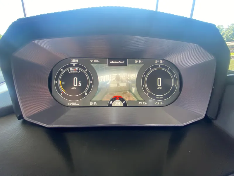 Slide: The Image of Dashboard of 2022 MasterCraft X26 boat displaying speed and RPM gauges. - 30