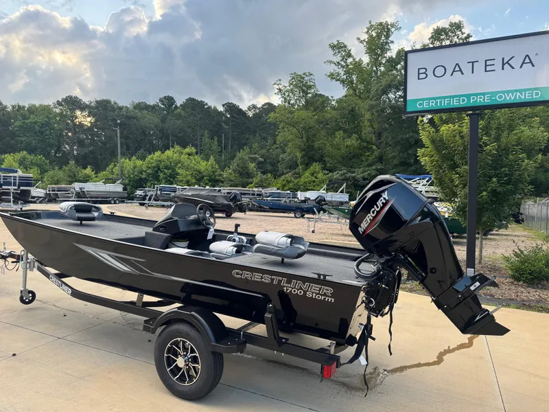 Slide: The Image of 2025 Crestliner 1700 Storm boat on trailer at Boateka dealership. - 2