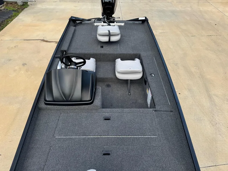 Slide: The Image of 2025 Crestliner 1700 Storm boat interior with seating and steering console. - 6