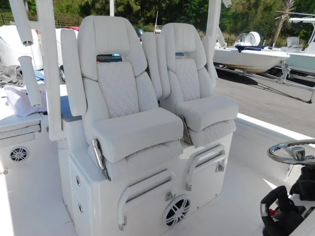 Slide: The Image of 2024 Regulator 30XO boat with luxurious white seating and modern design. - 11