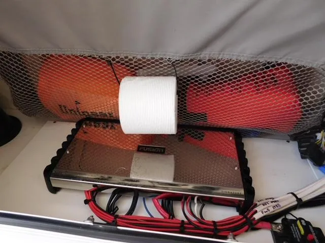 Slide: The Image of 2024 Regulator 30XO boat storage with electronics and safety equipment. - 16