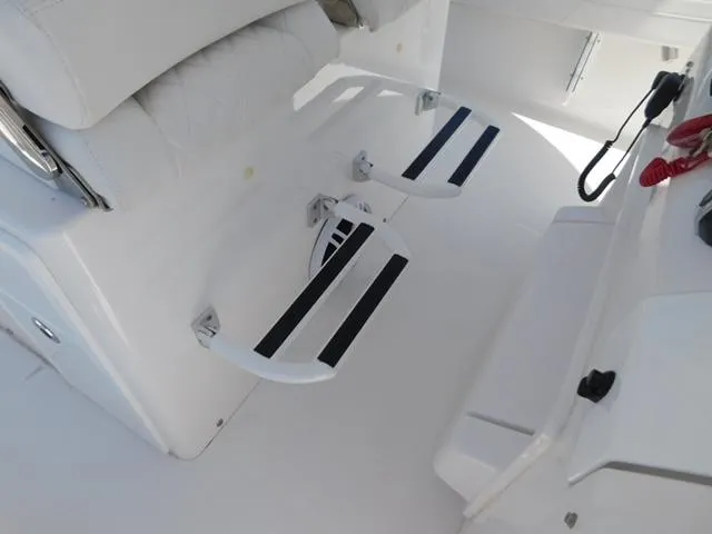Slide: The Image of 2024 Regulator 30XO boat interior with footrests and seating area. - 18