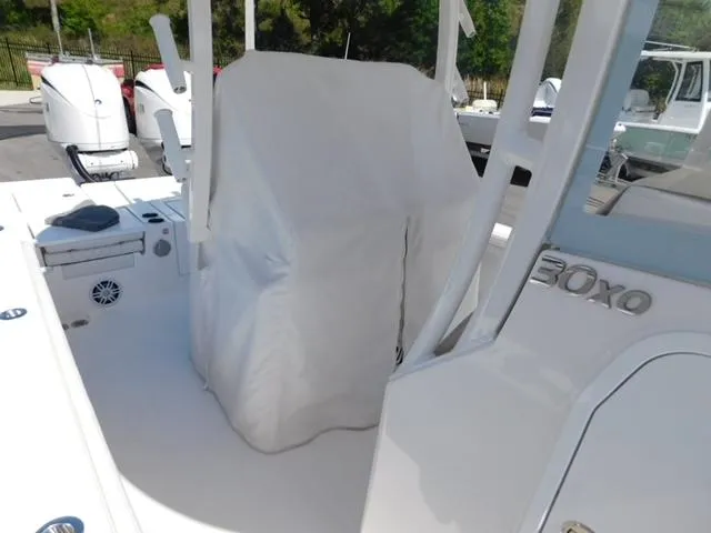 Slide: The Image of 2024 Regulator 30XO boat interior with covered console and seating. - 20