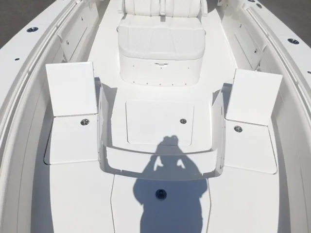 Slide: The Image of 2024 Regulator 30XO boat deck with seating and storage compartments. - 27
