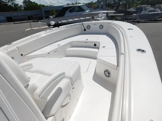 Slide: The Image of 2024 Regulator 30XO boat interior with white seating and spacious deck layout. - 29