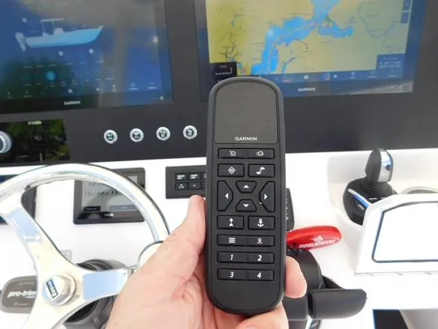 Slide: The Image of 2024 Regulator 30XO boat dashboard with Garmin remote and navigation screens. - 32