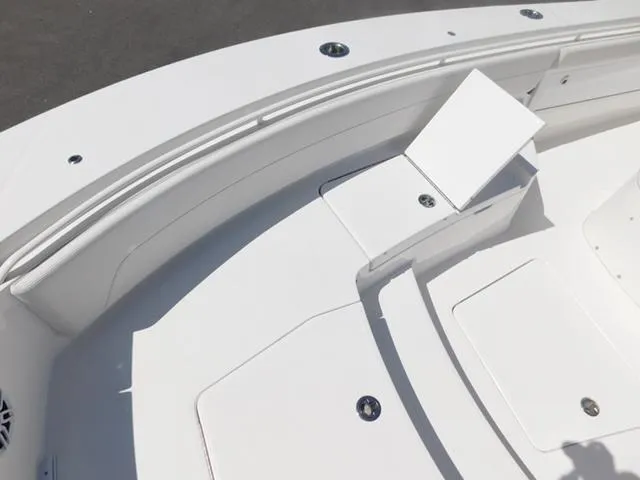 Slide: The Image of 2024 Regulator 30XO boat deck with seating and storage compartments. - 37
