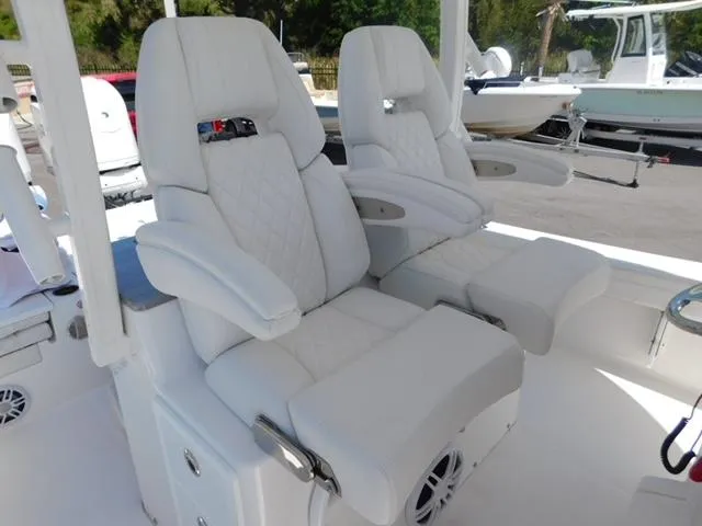 Slide: The Image of 2024 Regulator 30XO boat with luxurious white seating and armrests. - 4