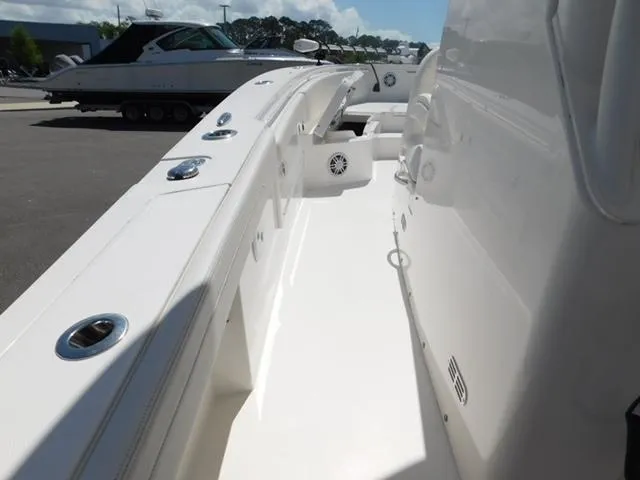 Slide: The Image of 2024 Regulator 30XO boat deck with sleek white finish and modern fixtures. - 48