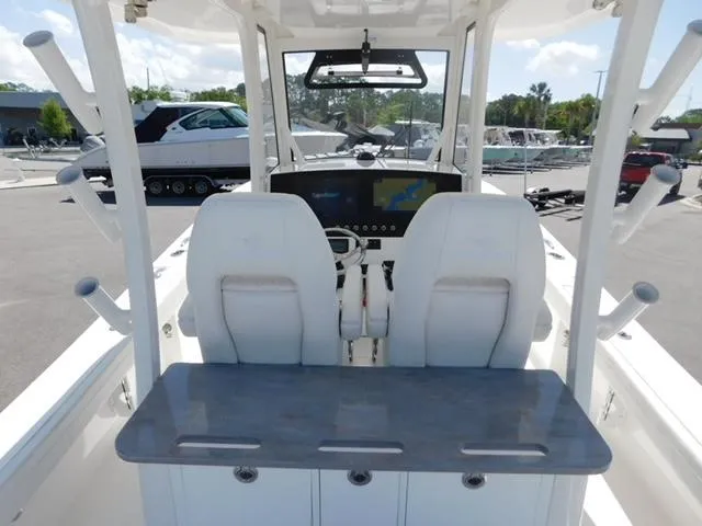 Slide: The Image of 2024 Regulator 30XO boat cockpit with dual seats and advanced navigation system. - 6