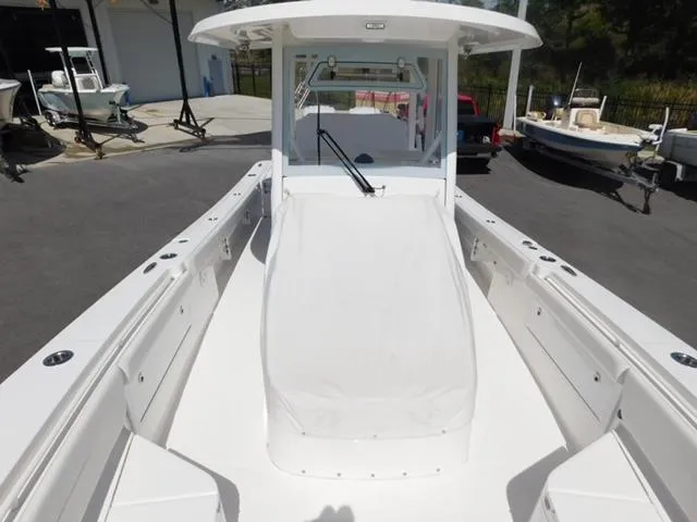 Slide: The Image of 2024 Regulator 30XO boat, white deck, center console, outdoor setting. - 7