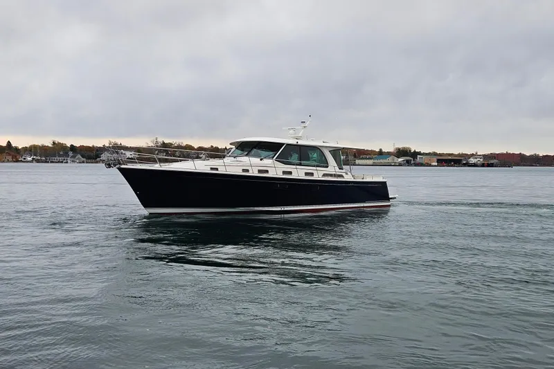 Slide: The Image of Luxurious interior of 2027 Sabre 51 Salon Express yacht with wooden cabinetry and cozy bedroom. - 20