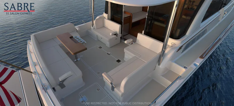 Slide: The Image of Luxurious interior of 2027 Sabre 51 Salon Express yacht with elegant seating and scenic views. - 6