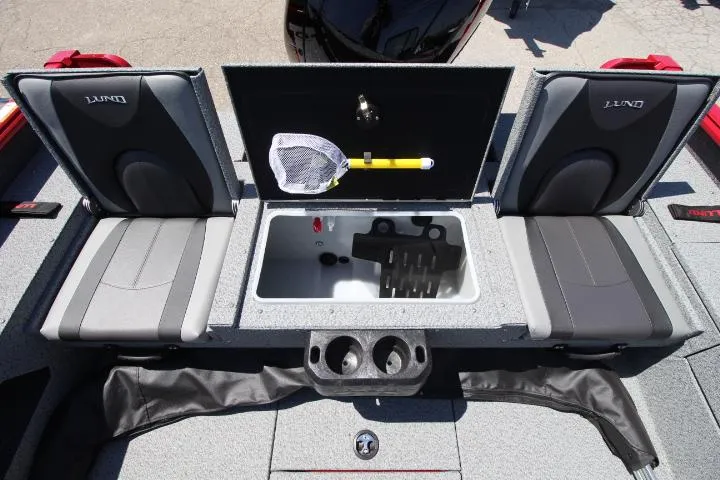 Slide: The Image of 2025 Lund 1875 Impact XS Sport boat interior with storage compartment and seating. - 11