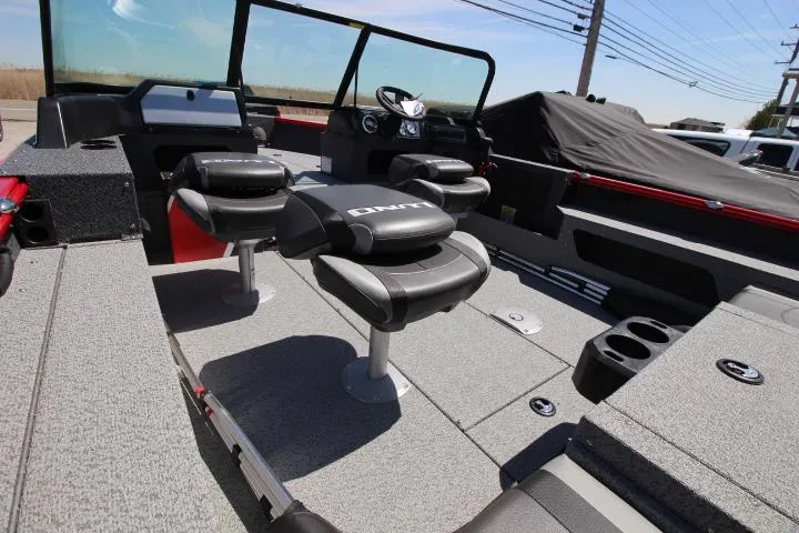 Slide: The Image of 2025 Lund 1875 Impact XS Sport boat interior with seating and steering console. - 5