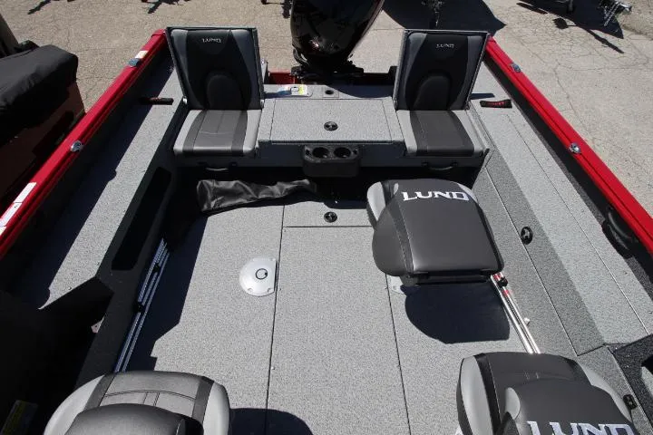 Slide: The Image of 2025 Lund 1875 Impact XS Sport boat interior with seating and storage compartments. - 7